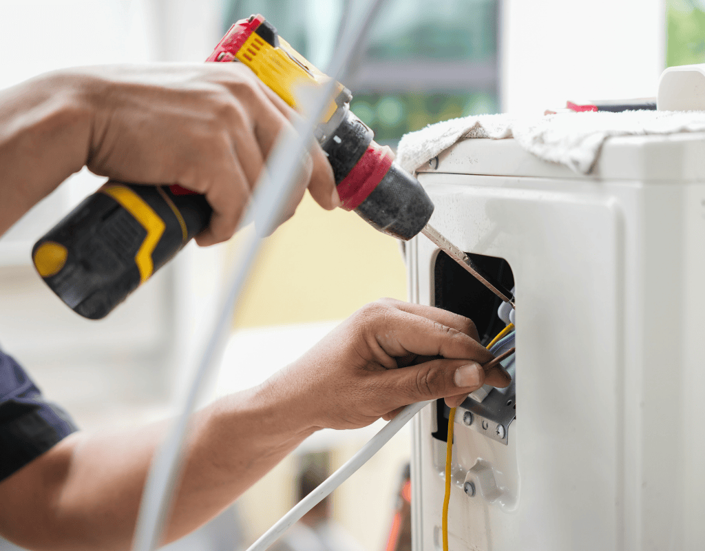 Professional electrician inspecting electrical panel and wiring system in residential property in North Shore MA